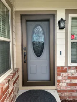 Installed bronze Centurion security screen door using marine-grade steel mesh