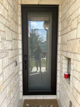 Modern Anodized Bronze Security Door Installed
