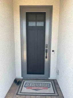 Grey Centurion security door with protective mesh and a soft modern color tone