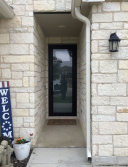 Rustic finish Bronze storm door as featured.