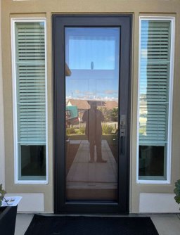 Rustic Bronze storm door enhancing curb appeal.