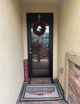 Custom Rustic Bronze storm door installed at a home.