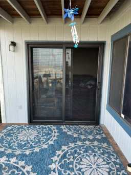 Home With Black Sliding Security Door Upgrade