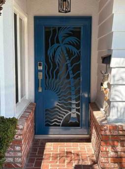 Custom blue Artisan security door in island design with decorative metalwork and airflow mesh