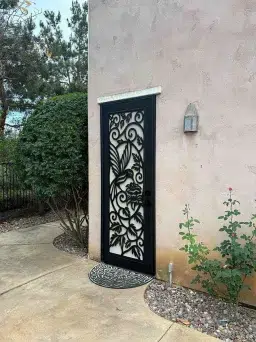 Statuary bronze Artisan security door with folkstone design and full airflow mesh