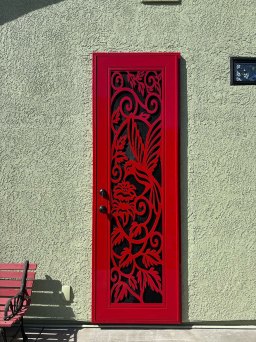 Dark red Artisan security door with spring song design and breathable protective mesh