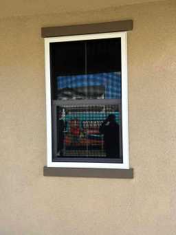 Home Protected With White Security Screens