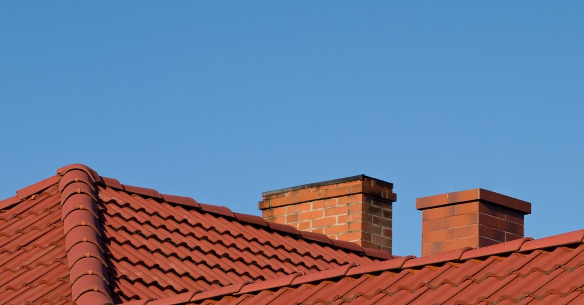 two-brick-chimneys-how-can-regular-chimney-maintenance-protect-your-home-den-defenders