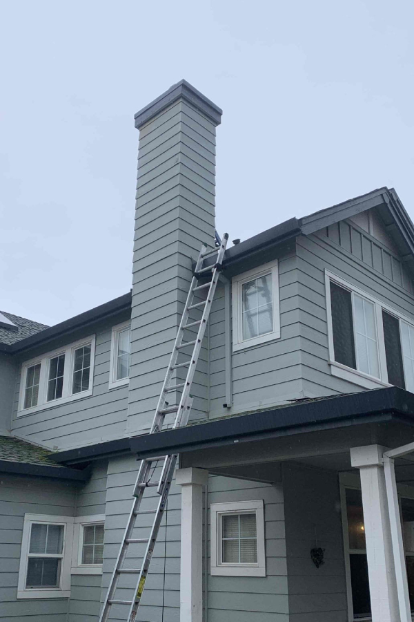 high-gray-chimney-importance-of-chimney-cleaning-should-i-get-a-professional-chimney-sweep-den-defenders